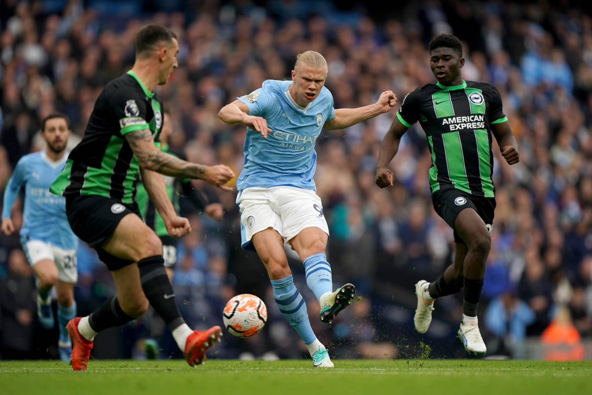 Erling Haaland pictured (center) shooting from outside of the 18-yard box to score for Manchester City against Brighton in October 2023